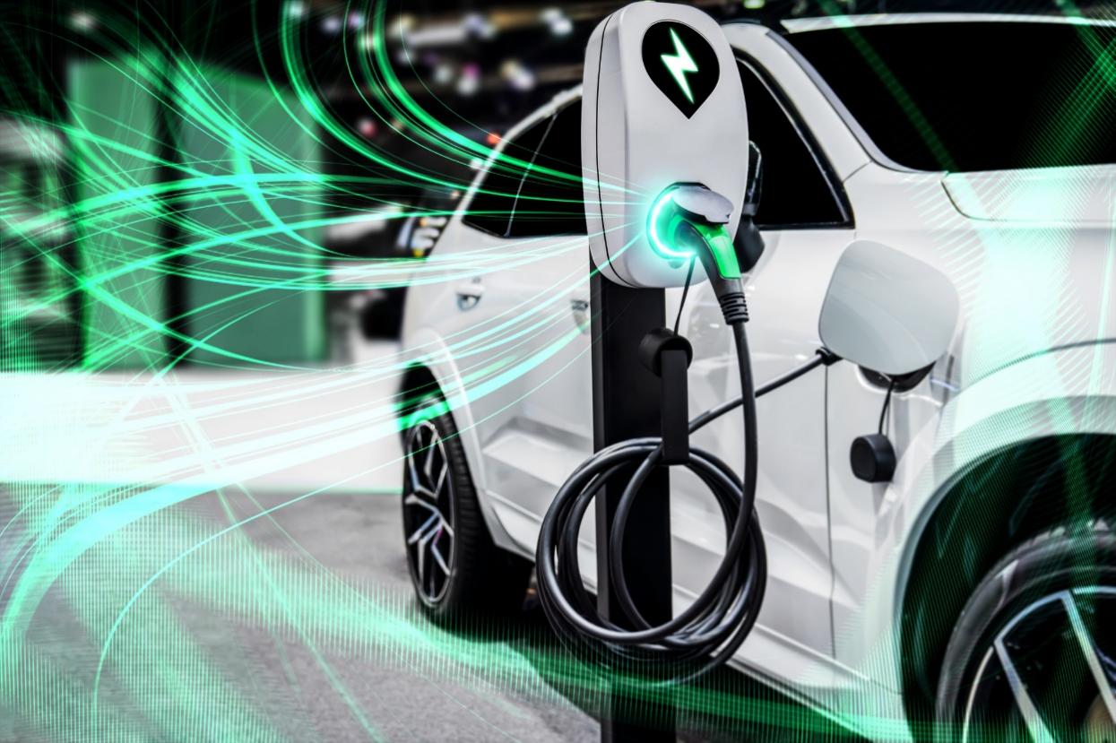 A white car with a charging station

AI-generated content may be incorrect.